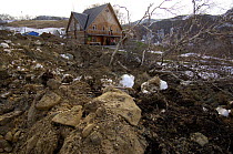 Earth from a landslide in the Valley of the Geysers, Kronotsky Zapovednik, Kamchatka, Far East Russia On June 3, 2007, a landslide of rocks, snow, ice and trees stopped short of the guest house in th...