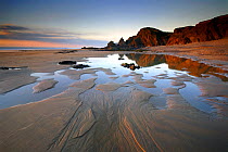 Sandymouth Bay, beach at low tide in evening light, near Bude, Cornwall, UK. February 08.