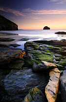 Trebarwith strand at sunset, rocks at low tide, north Cornwall, UK. June 08.