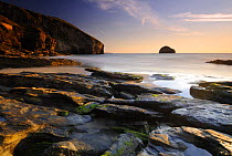 Trebarwith Strand at sunset, rocks at low tide, north Cornwall, UK. June 08.
