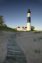Weathered boardwalk leading up to Big Sable Lighthouse on Big Sable Point, Lake Michigan shoreline, Michigan, USA