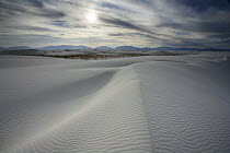 Ripples and ridges in the sands of White Sands National Park with San Andres Mountains on the horizon, Chihuahuan Desert, New Mexico, USA