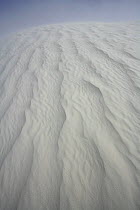 Wind blowing sand over the ridge, White Sands National Park, Chihuahuan Desert, New Mexico, USA