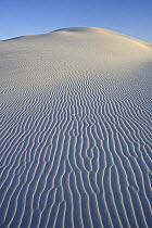 Ripples in white sand running down side of large rounded dune, White Sands National Park, Chihuahuan Desert, New Mexico, USA