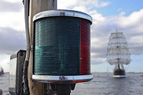 Green and red starboard/port lights aboard "Enterprise III", with tall ship "Sedov" in the background. Funchal 500 Tall Ships Regatta race day, Saturday 13th September 2008. Falmouth, Cornwall, UK