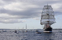 Tall ship "Sedov" flanked by spectator boats at the Funchal 500 Tall Ships Regatta race day, Saturday 13th September 2008. Falmouth, Cornwall, UK