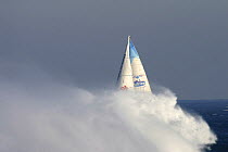 Jean Luc van den Heede arriving at Oessant (Ushant) in a cloud of spray, after record circumnavigation of 122 days, 14 hours, 3 minutes and 49 seconds. Global Challenge, March 2004