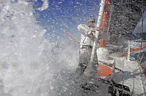 Vincent Riou aboard 60ft PRB "Imoca" amongst sea spray, April 2008