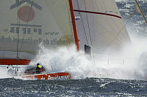Vincent Riou aboard 60ft PRB "Imoca" amongst sea spray, April 2008