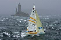 Atao Audio Systems yacht passing Vieille lighthouse in heavy seas, Round Brittany Race, 2005