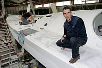 Skipper Armel le Cleac'h with his monohull 60ft ^Brit Air^ yacht during construction. Vannes, France, June 2007