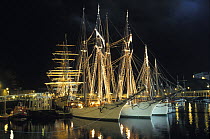 Tall ships on harbour at night, Douarnenez Maritime Festival, France 2000