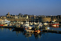 Fishing boats moored alongside jetty in Concarneau, Finistere, Brittany, France