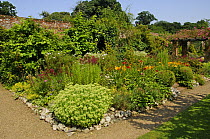 Large garden border planted with perennials and shrubs, Gunthorpe Hall, Norfolk, UK, July