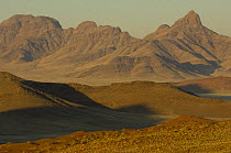 Mountain scenery, Namibrand Nature Reserve, on the edge of the Sossusvlei dunes, Namib Desert, Namibia. July 2008.