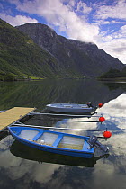 Early Morning with moored boats on Naeroyfjord, near Bakka, Sognefjord, Norway