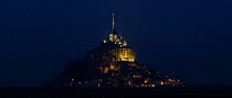 The Mont Saint Michel abbey floodlit at night, Normandy, France. 2008.