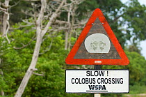 Speed warning sign near Jozani Chwaka Bay NP, Zanzibar, Tanzania, to protect  Zanzibar Red Colobus monkeys (Procolobus kirkii)