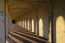Portico dei capuccini, arches and shadows in the 18th century cloisters, Comacchio, NE Italy