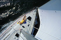 Woman sunbathing on deck of Felling 396 yacht, 1998