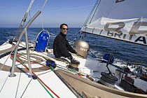 Skipper Armel le Cleac'h at the helm of Monohull Imoca 60ft "Brit Air", Concarneau, Brittany, France. April 2008