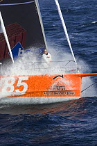 Monohull Open 60ft "PRB" with skipper Vincent Riou on bow, Vendee Globe 2008-2009. October 2008.