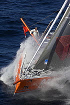 Monohull Open 60ft "PRB" with skipper Vincent Riou holidng outrigger pole, Vendee Globe 2008-2009. October 2008.