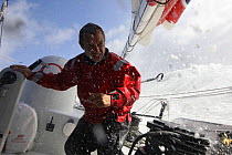 Skipper Roland Jourdain hit by spray on his Monohull Open 60ft "Veolia Environment" during Vendee Globe 2008-2009, October 2008.