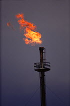 Gas flare at oil refinery, New Mexico, USA