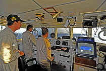 Crew on the bridge of Brazilian Navy ship "Grajau" following "Telefonica Blue" rounds the Brazilian island of Fernando de Noronha, during the 10th Volvo Ocean Race (2008-2009), October 23rd 2008. For...