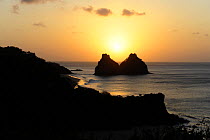 Sunset over rocky islets on the coast of Brazilian island Fernando de Noronha, October 2008. For EDITORIAL USE only.