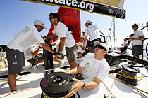 "Green Dragon" crew and "Puma" (background) in-port race training in Alicante, Spain, for the 10th Volvo Ocean Race 2008-2009. For EDITORIAL USE only.