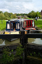 Narrow boats on the Kennet and Avon canal at the top of the Caen Hill flight of locks, Wiltshire. September 2008