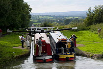 Narrow boats on the Kennet and Avon canal at the top of the Caen Hill flight of locks, Wiltshire. Sepctember 2008