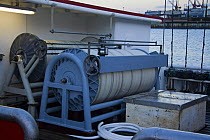 Radio markers and miles of monofilament line on spools on deck of long lining boat in Honolulu Harbour, Oahu, Hawaii. July 2007.