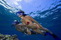 A couple free diving. Hawaii. June 2006. Model released