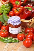 Country Kitchen scene with home made chutney and ingredients - tomatoes and peppers, UK, September