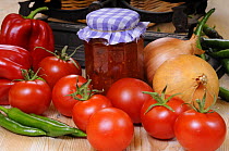 Country Kitchen scene with chutney ingredients (Tomatoes, peppers and onions) and traditional kitchen scales, UK, September