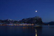 Moon shining over the Norwegian settlement of Forsand by Lysefjorden, Rogaland, Norway.