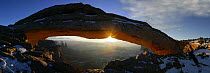 Sun rising through Mesa arch, Canyonlands NP, Utah, USA