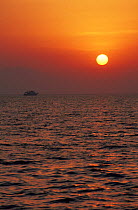 The sun sets over the mountains of southern Egypt in the Red Sea.