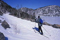 Cross country skiing on the Carriage Roads next to Jordan Pond and the Bubbles, Acadia NP, Maine, USA