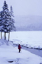 Snowshoeing along the shores of Second Connecticut Lake, Pittsburg, New Hampshire, USA
