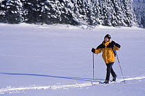 Cross-country skiing across Second Connecticut Lake, Pittsburg, New Hampshire, USA
