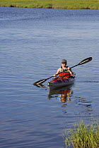 Kayaking in the tidal estuary, Plum Island Sounds, Sawyer's Island, Rowley, Massachusetts, USA.