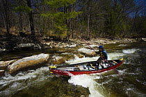 Poling canoe on the Ashuelot River, a tributary of the Connecticut River, Surry, New Hampshire, USA