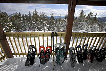 Snowshoes on the front porch of the Appalachian Mountain Club's Hi-Cabin on the Hurricane Gap Trail, Mount Cardigan, Canaan, New Hampshire, USA