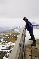 Matt Heid leaning into 50 mph winds at the Observation Deck on Mount Washington, New Hampshire, USA