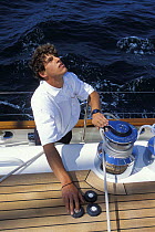 Crew trimming the sails with an electric winch aboard 118ft schooner "Magistral", 2002.