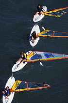 Children learning to windsurf at a Sailing school on Les Glenan's Island, Brittany, France 1998.
